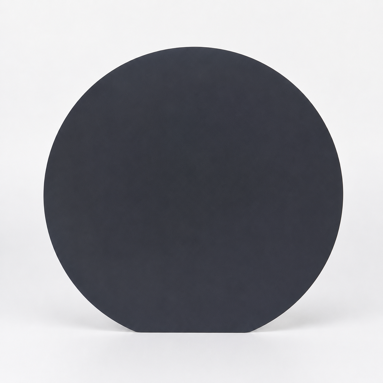 Fig. 1 — Silicon epitaxial wafer. Epitaxial silicon remains the substrate of choice where defect-free surfaces and controlled resistivity profiles are required.
